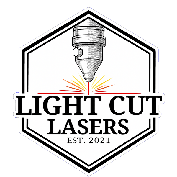 A die-cut sticker or decal featuring a black and white line-art illustration of a laser cutting head with red and yellow laser rays, inside a hexagonal border. The text reads 'LIGHT CUT LASERS' and 'EST 2021'
